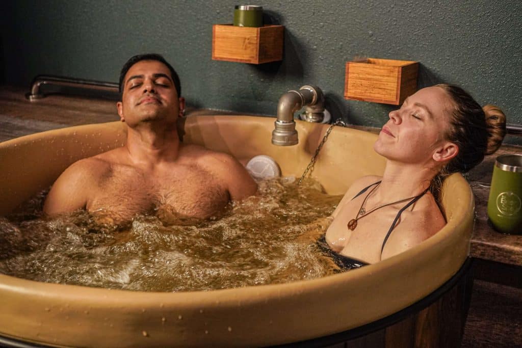 man and woman relaxing at the spa - post-holiday blues