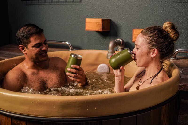 man and woman taking a beer bath - spa treatments