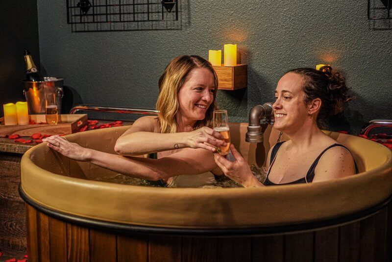 2 women in beer bath - couples spa packages denver