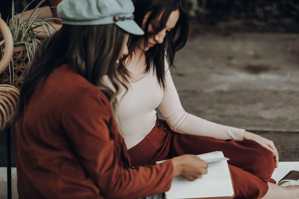 two girls reading a letter