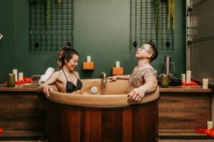 couple enjoying The Beer Spa's hydrotherapy tub