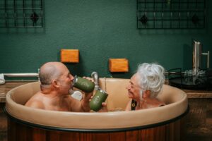 couple enjoying beer bath hydrotherapy at The Beer Spa
